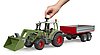 Fendt Vario 211 with frontloader and tipping trailer