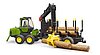 Porteur forestier John Deere 1210E avec grappin à bois