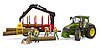 John Deere 7R avec remorque forestière et 4 troncs d’arbre
