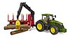 John Deere 7R 350 with forestry trailer and 4 trunks