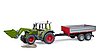 Fendt Vario 211 with frontloader and tipping trailer